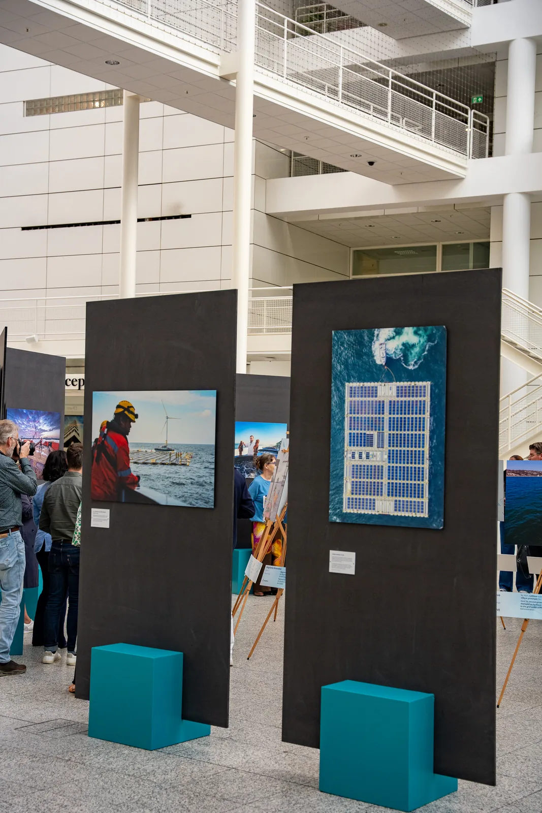 Visitors between the panels during the opening